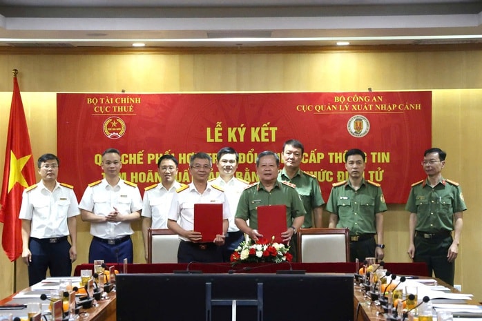 Cục Thuế phối hợp với Bộ Công an về phương thức "thông báo tạm hoãn xuất cảnh khi nợ thuế"- Ảnh 1.