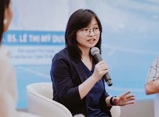 A person holding a microphone AI-generated content may be incorrect.