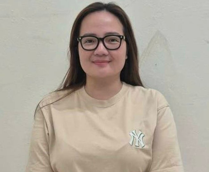 Doanh nhân Hoàng Hường tại cơ quan điều tra. Ảnh: Bộ Công an