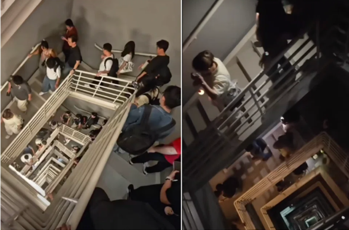 Hàng trăm nhân viên đi xuống 100 tầng khi thang máy ngừng hoạt động tại tòa nhà The Exchange 106 , Malaysia, chiều 15/10. Ảnh: Brian Lee/Facebook