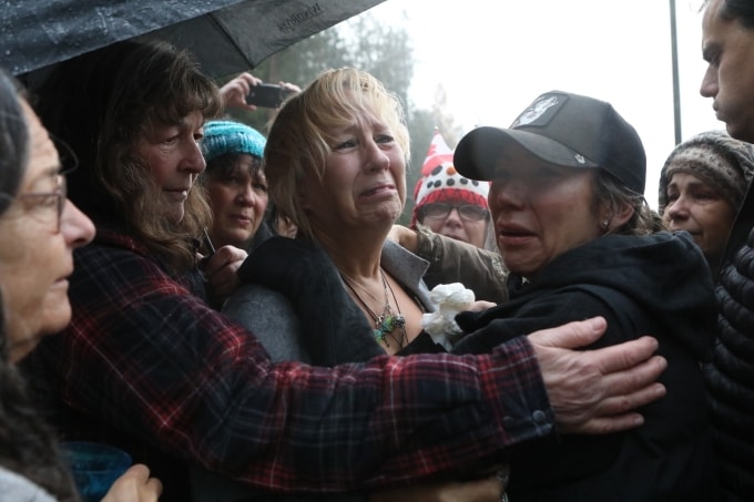 Karen Espersen, the co-owner of Universal Ostrich Farms, is embraced by supporters and her daughter, Katie Pasitney, at the farm in Edgewood, B.C., after the Supreme Court of Canada declined to hear the farm’s appeal against an order to cull more than 300 of its ostriches on Thursday, Nov. 6, 2025. THE CANADIAN PRESS/Aaron Hemens