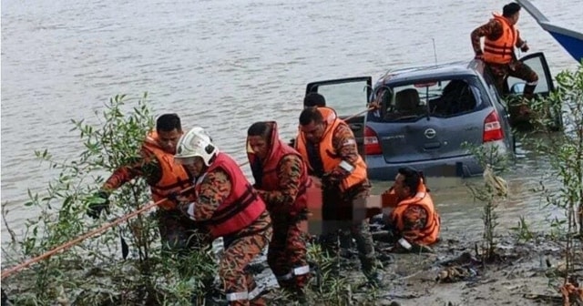 Ô tô mất lái lao xuống sông, nữ tài xế tử vong thương tâm - Ảnh 1.