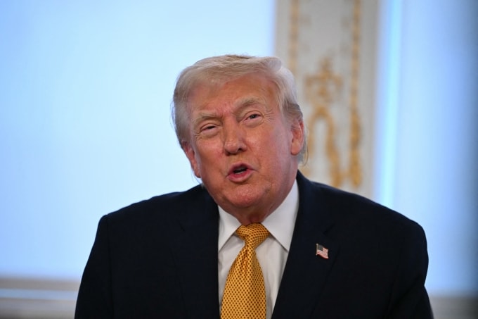 US President Donald Trump participates in calls to US service members, on Christmas Eve, from the Mar-a-Lago club in Palm Beach, Florida, December 24, 2025. (Photo by ANDREW CABALLERO-REYNOLDS / AFP)