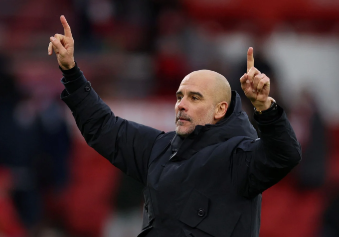 HLV Pep Guardiola ăn mừng sau trận Man City thắng Nottingham Forest 2-1 ở vòng 18 Ngoại hạng Anh trên sân City Ground, thị trấn West Bridgford, hạt Nottinghamshire, Vương quốc Anh ngày 27/12/2025. Ảnh: Reuters
