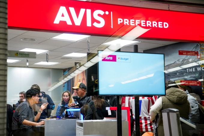 People wait at car rental company, at the Atocha train station, amid train delays and cancellations, following a deadly derailment of two high-speed trains in Adamuz near Cordoba, according to local police reports, in Madrid, Spain, January 18, 2026. REUTERS/Ana Beltran