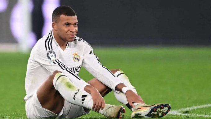 Mbappe bị đau trong một trận Champions League cùng Real Madrid. Ảnh: AFP