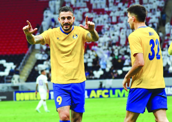 Joselu (trái) mừng bàn trong trận Al Gharafa thắng Al Ain 4-2 tại AFC Champions League Elite trên sân Al Bayt, Al Khor, Qatar ngày 2/10/2024. Ảnh: Gulf Times