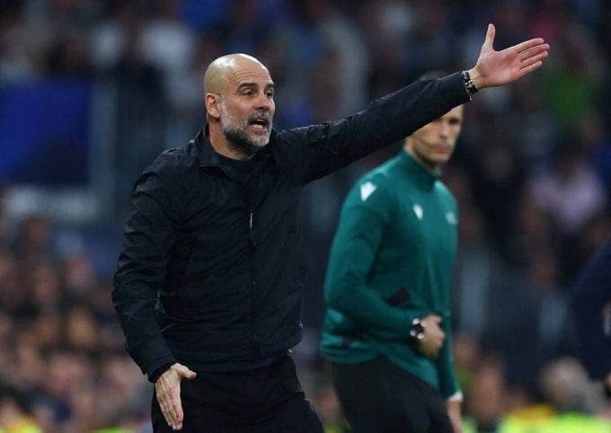 HLV Pep Guardiola chỉ đạo trong trận Real 3-0 Man City ở lượt đi vòng 1/8 Champions League tối 11/3. Ảnh: Reuters