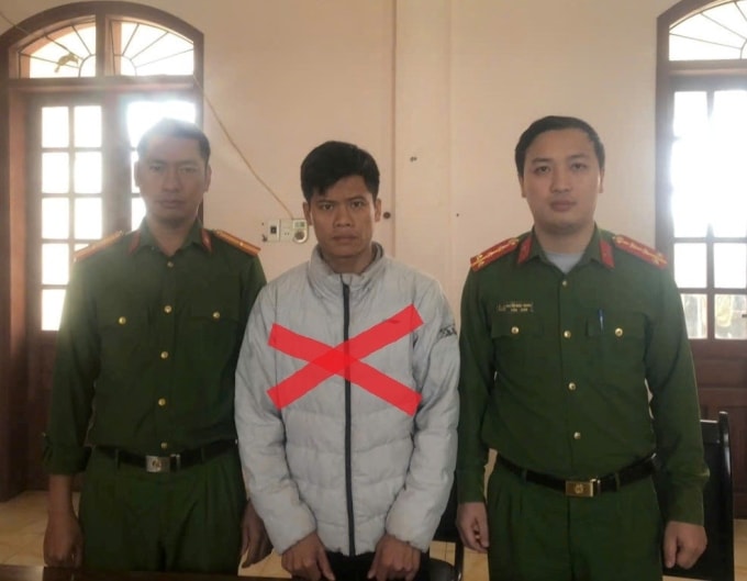 Bàn Văn Huấn tại cơ quan công an. Ảnh: Xuân Hoa