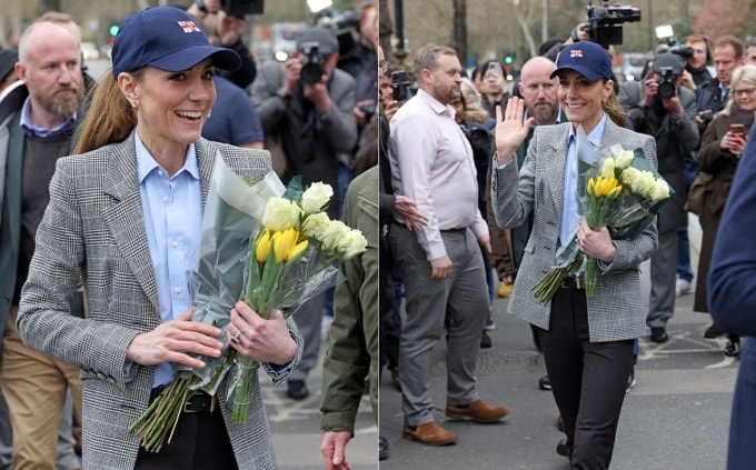 Vương phi Kate vẫy chào và nhận hoa từ người hâm mộ khi tham gia sự kiện cùng chồng, Thái tử William, dọc bờ sông Thames tại London hôm 12/3. Ảnh: GC Images