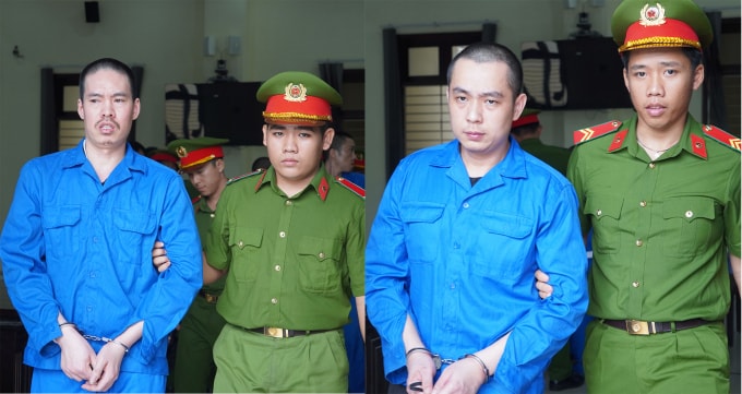 Lê Nguyên Bình và Phạm Lý Phương bị cảnh sát dẫn giải ra xe sau phiên xử. Ảnh: Hoàng Nam