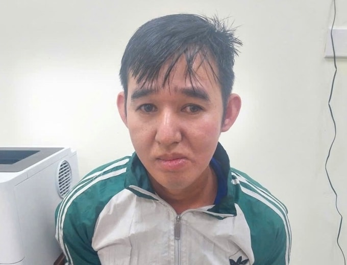 Lê Hoàng Minh tại cơ quan công an. Ảnh: Công an cung cấp