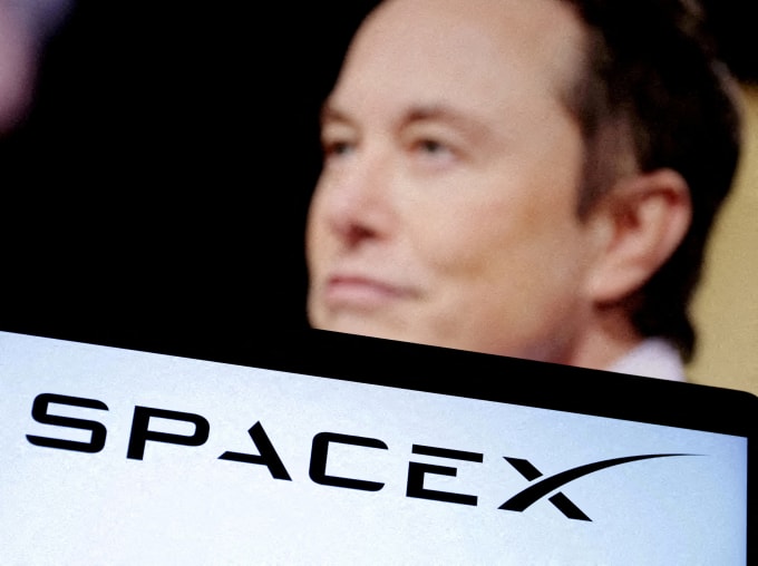 SpaceXs logo and an Elon Musk photo are seen in this illustration created on December 19, 2022. REUTERS/Dado Ruvic/Illustration/File Photo/File Photo