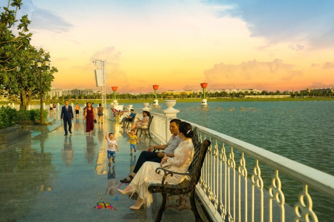Người lớn và trẻ nhỏ thư giãn trong không gian ven sông. Ảnh: VPG
