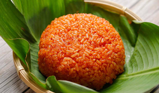 Mách bạn cách nấu xôi gấc cúng Tết để năm mới "đỏ như son"