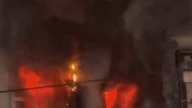 Giải cứu người đàn ông kẹt trong đám cháy tiệm giặt đồ